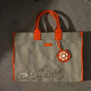 Large Henri Bendel Brown and White Striped Tote with Orange Accents.